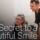 doctor and assistant smiling looking at computer